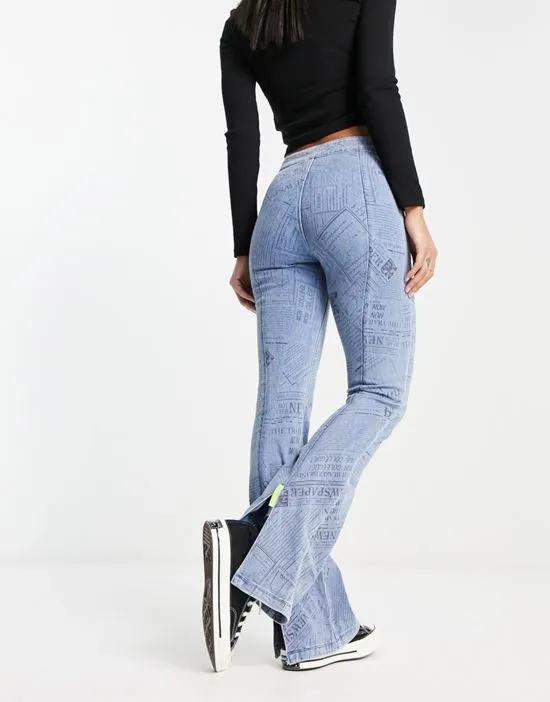 boot cut flare denim jeans with graphic detailing in blue