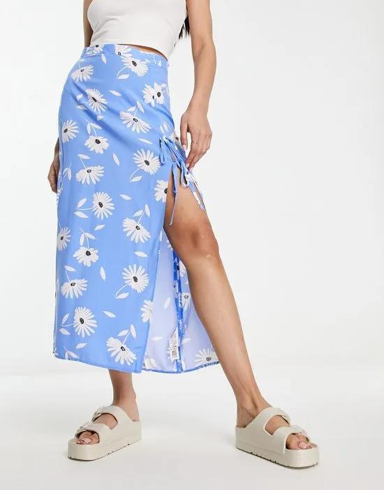 bow detail midi skirt with thigh split in blue daisy print
