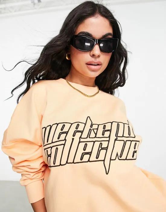boxy sweatshirt with futuristic logo in apricot - part of a set