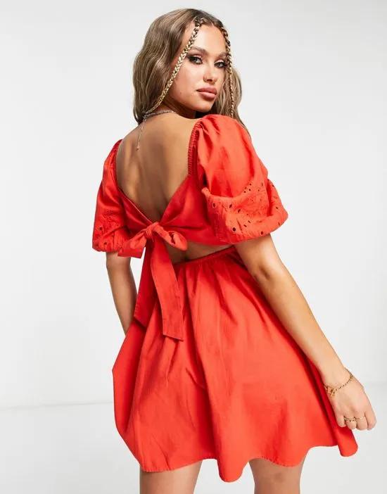 broderie bow back mini dress in red