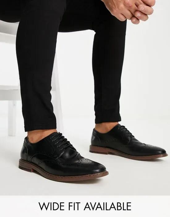 brogue shoes in black faux leather