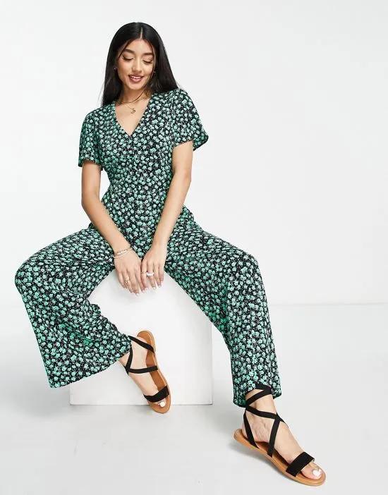 bubble short sleeve tea culotte jumpsuit in black and green floral