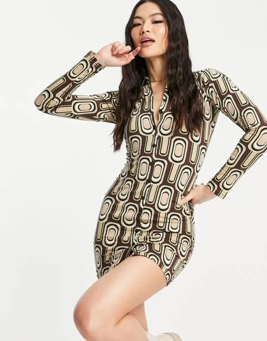 button front body-conscious shirt dress in 70s spot print
