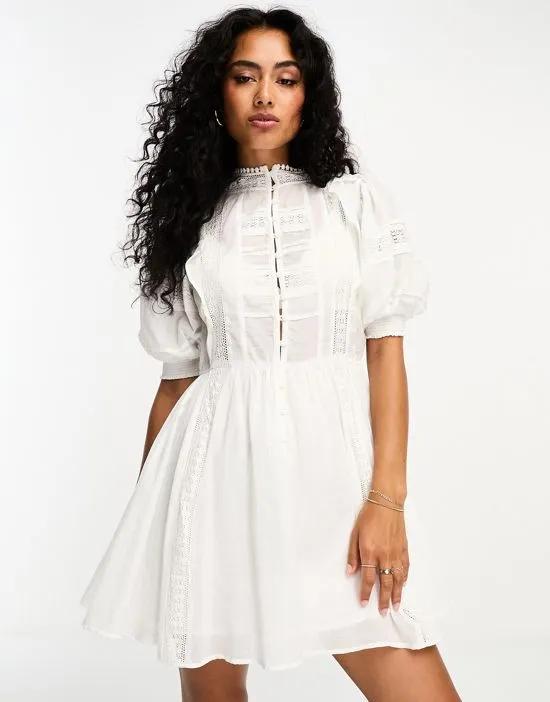button front broderie mini dress in white