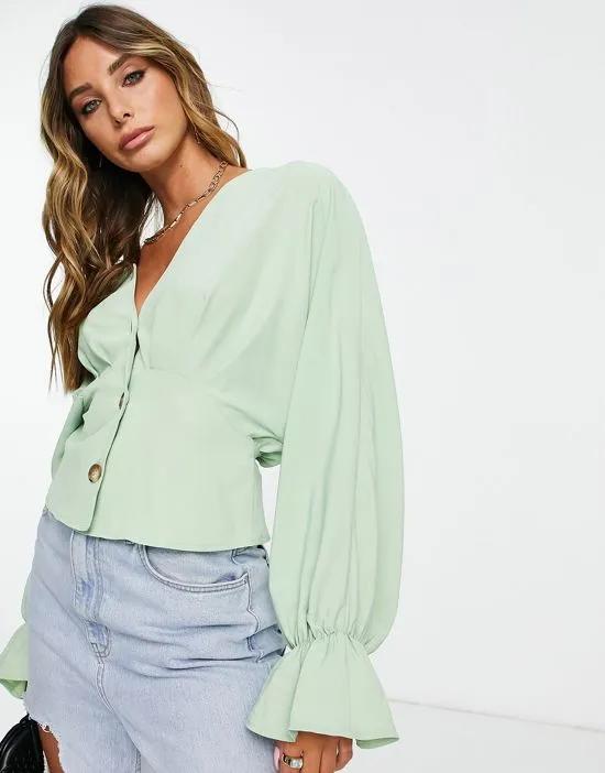 button front long sleeve tea blouse with pleat detail in pistachio green