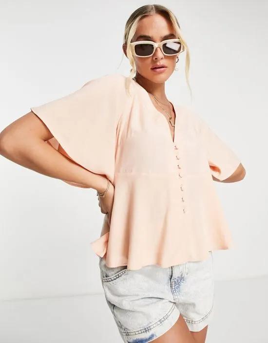 button front tee blouse with flutter sleeve in peach