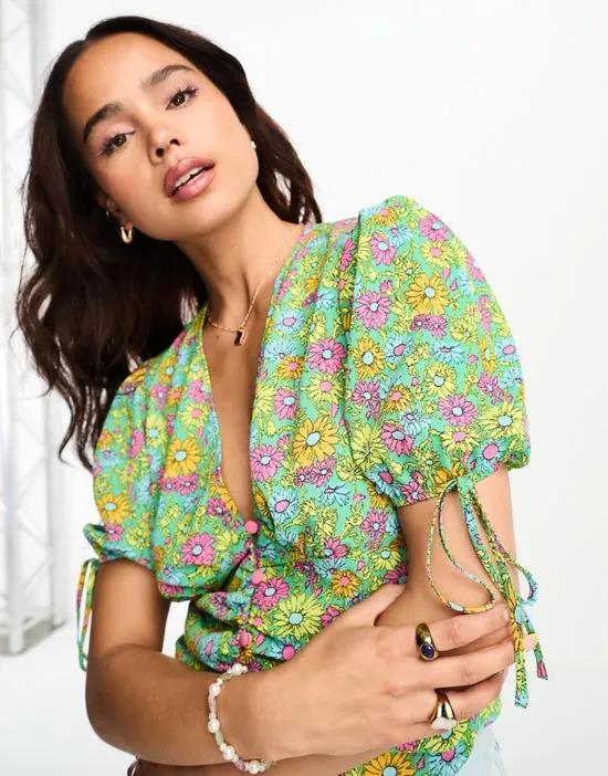 button front tee blouse with ruched waist in bright daisy floral print