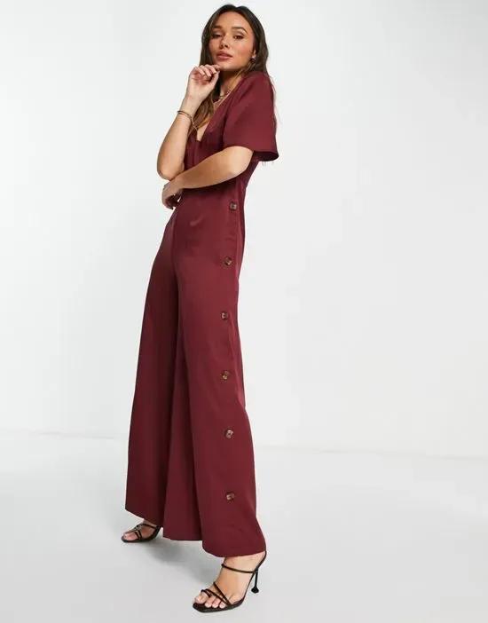 button side batwing jumpsuit in berry