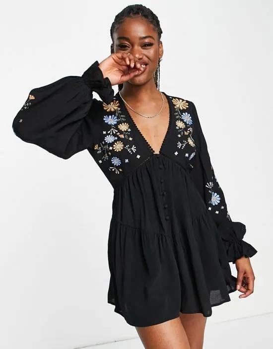button through embroidered romper in black