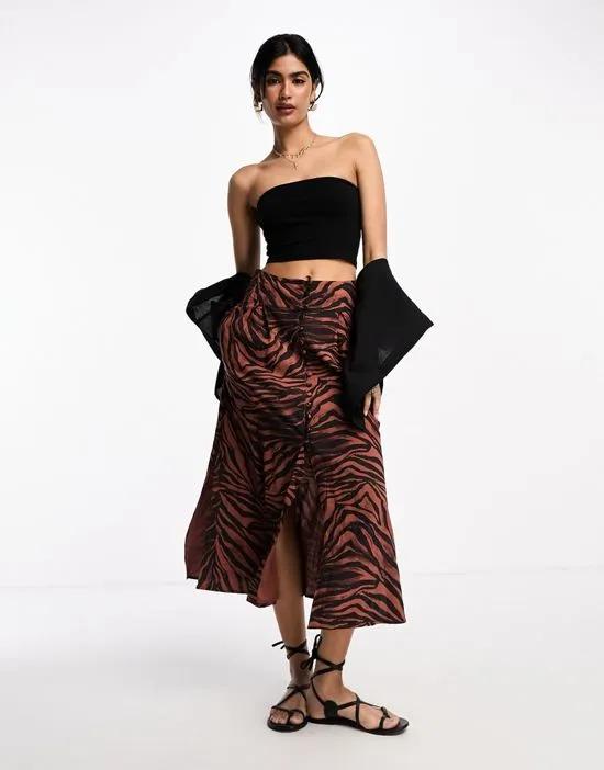 button through midi skirt with slit in dark zebra print