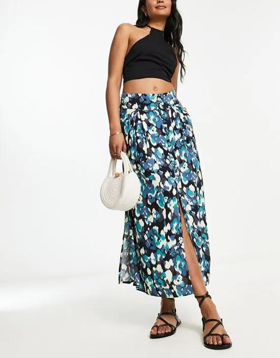 button through midi skirt with split in green and black abstract print