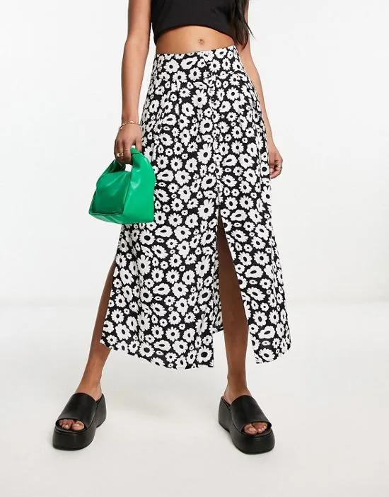 button through midi skirt with split in mono daisy print