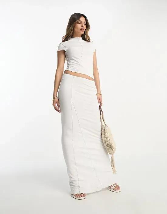 cap sleeve maxi dress with cut-out waist and seam detail in white
