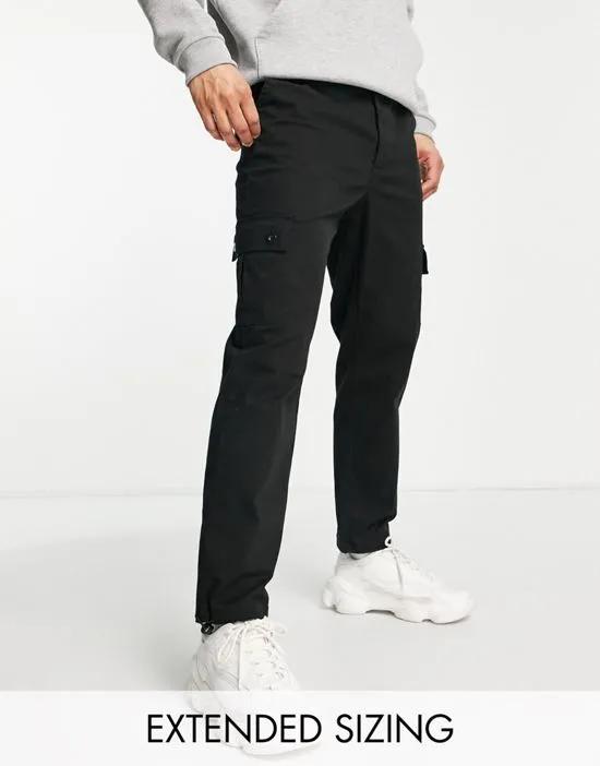 cargo tapered pants in black with toggles