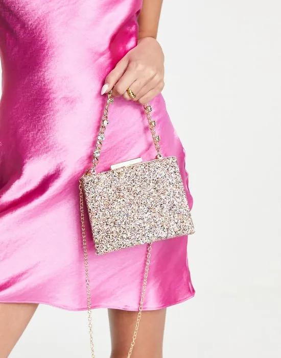 clutch bag  with chunky chain grab handle in pink glitter