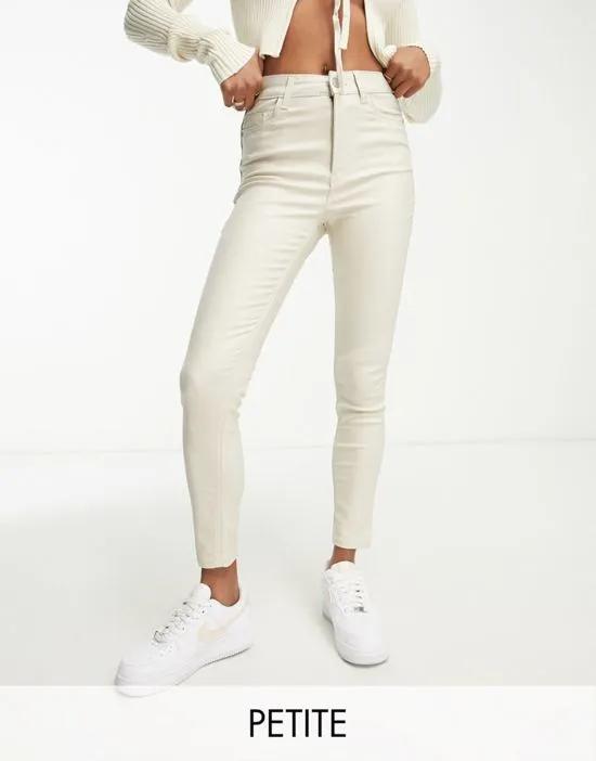 coated skinny jeans in off white