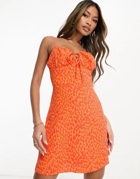 Collective the Label exclusive ruched bust mini dress in orange heart print
