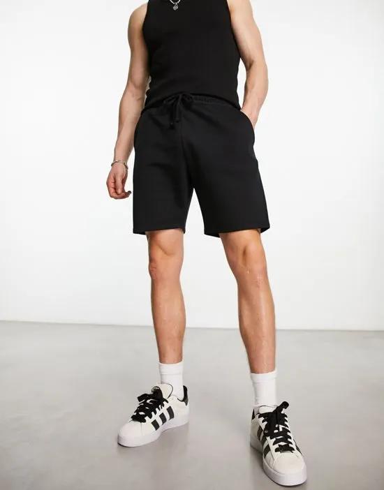 COLLUSION jersey shorts in black
