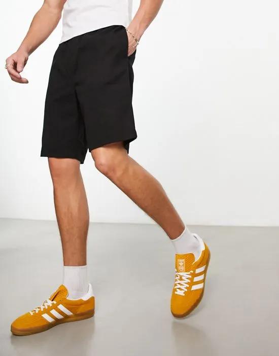 COLLUSION pull-on shorts in black