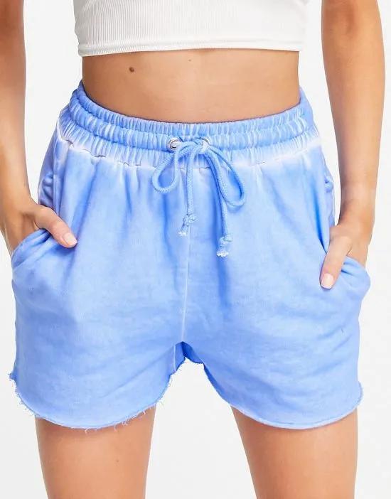 COLLUSION raw edge washed shorts in blue