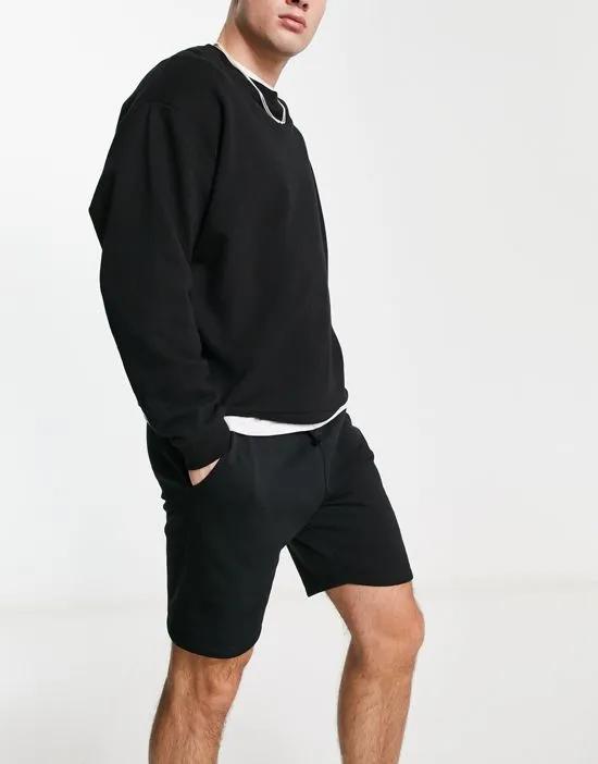 COLLUSION shorts in black