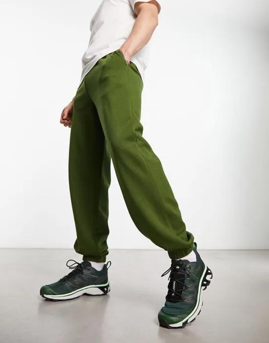COLLUSION sweatpants with embroidered logo in dark green
