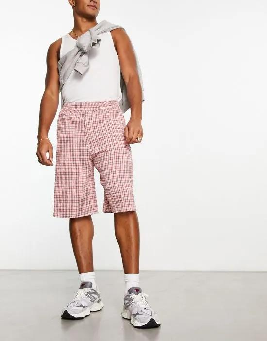 COLLUSION textured baggy skater shorts in pink plaid