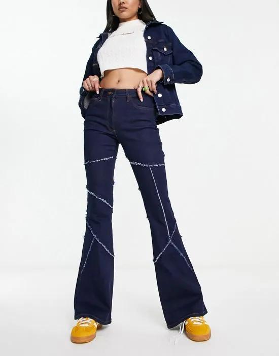 COLLUSION x008 exposed seam flare jeans in indigo