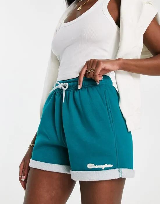 color block fleece shorts in teal and cream
