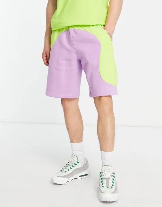 Color Clash colorblock shorts in lime