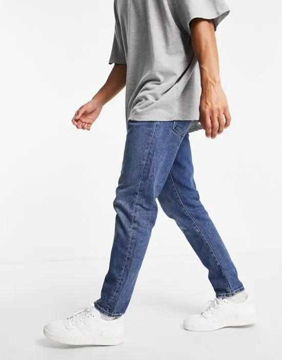 cotton slim tapered jeans in mid blue - MBLUE