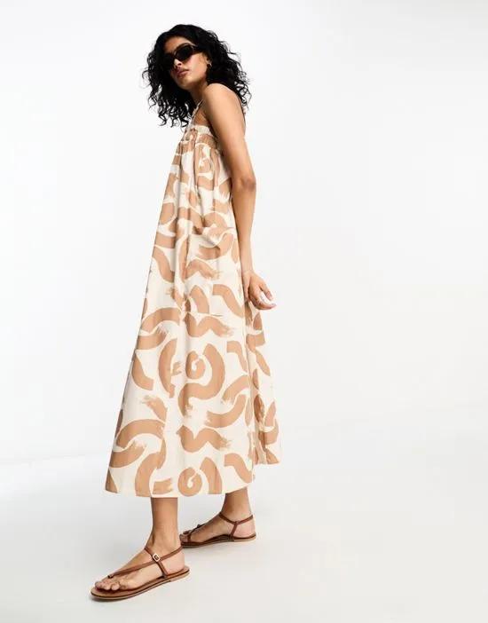 cotton trapeze overall midi sundress in brown abstract print