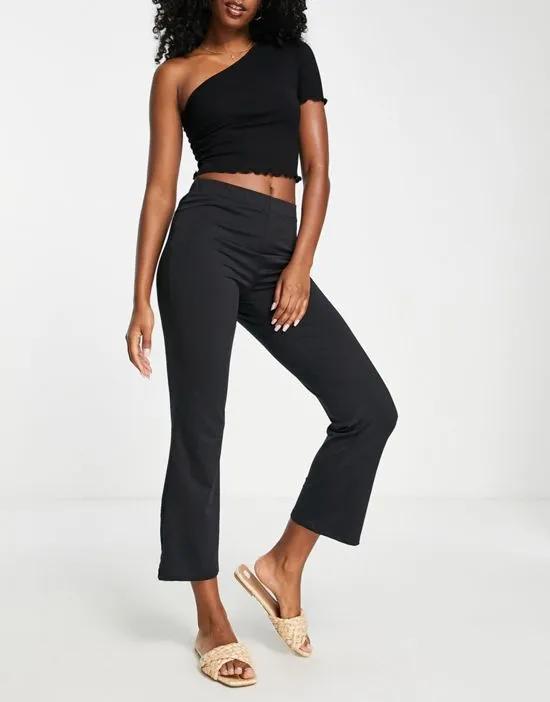 cropped kick flare pants in black