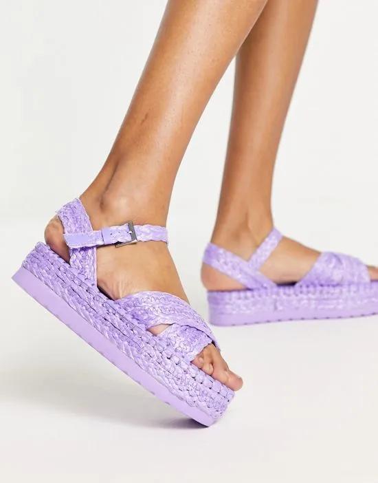 crossover flatform sandals in lilac raffia