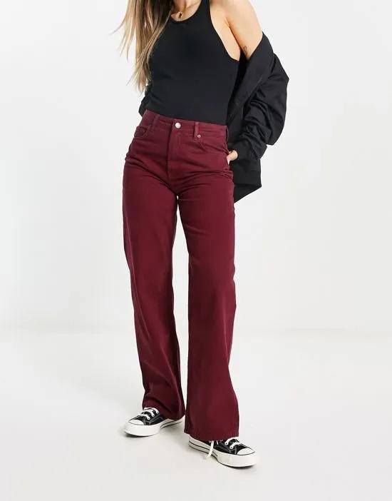 dad jeans in washed burgandy