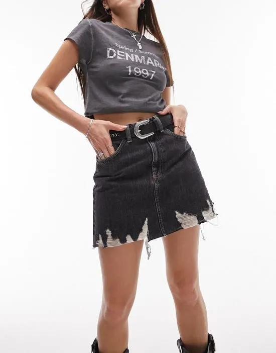 denim high waist skirt with ripped hem in washed black