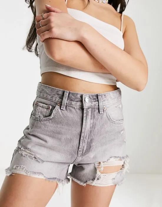 denim short with rips in washed gray