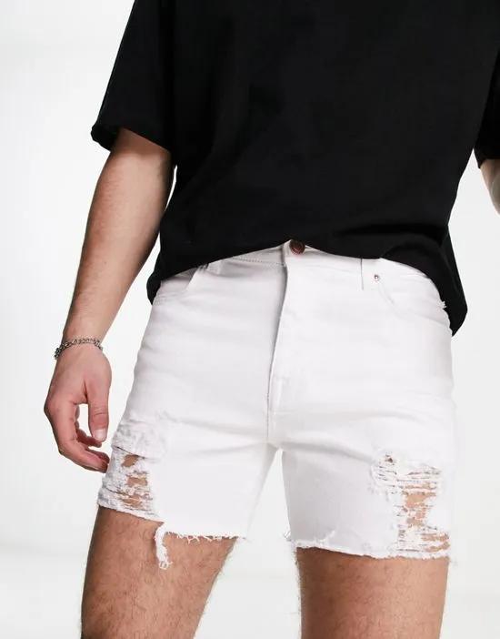 denim shorts in shorter length with rips in white