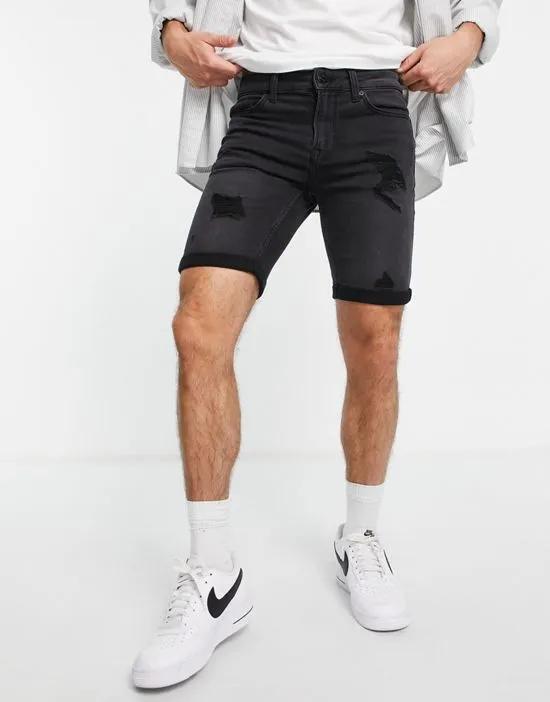 denim shorts in slim fit with distressing in black