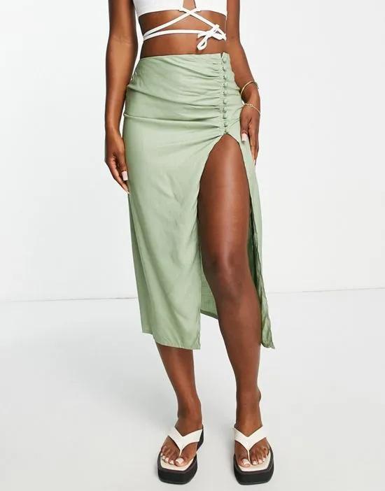 drapey button side thigh slit midi skirt in sage green