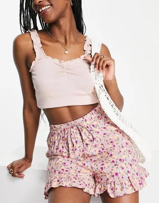 elasticated waist short with frill hem in pink based floral