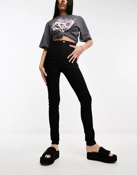 Ella super-high waist skinny jeans in black