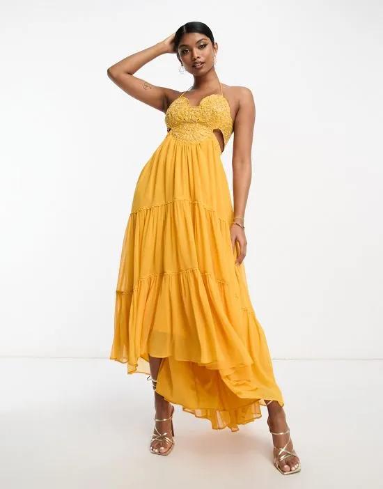 embellished bodice tiered maxi dress with hi low hem and open back in mustard