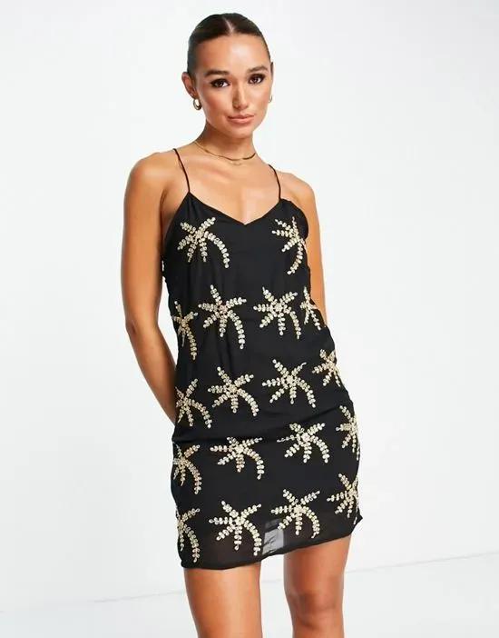embellished palm print mini dress in black and gold