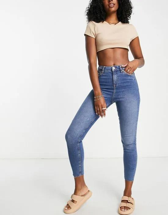 Emily high rise skinny jeans in midwash blue