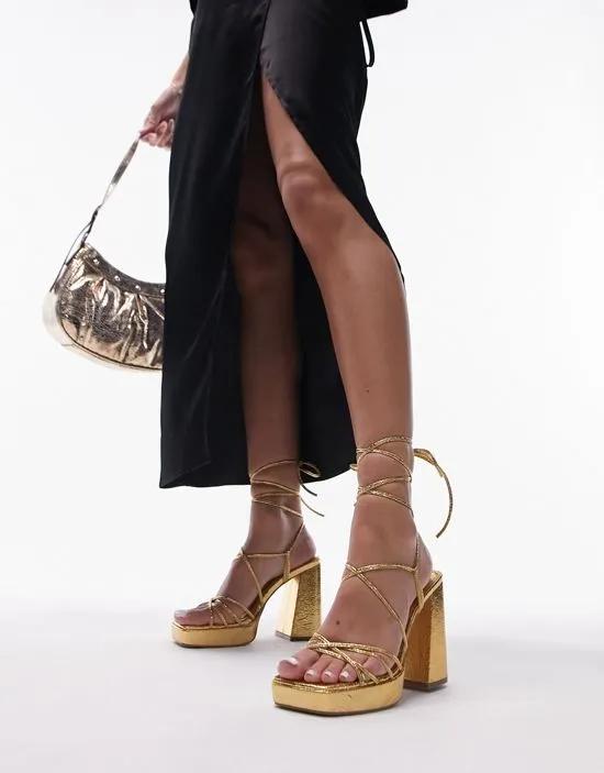 Eve heeled platform sandals with ankle tie in gold