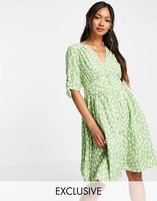 exclusive mini tea dress in green spot print