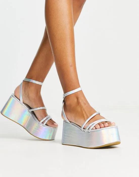 extreme flatform heeled sandals in silver holographic