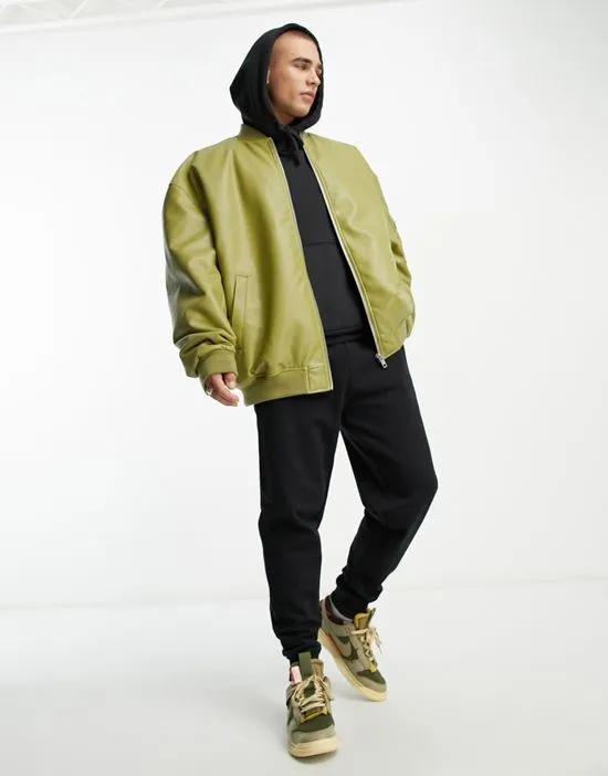 extreme oversized faux leather bomber jacket in green