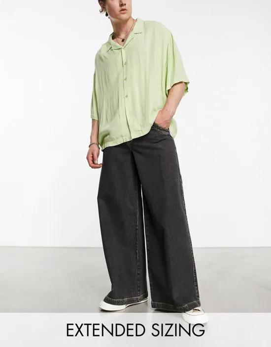 extreme wide leg jeans with contrast green stitch in washed black